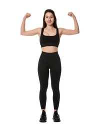 Woman in sportswear showing her biceps on white background