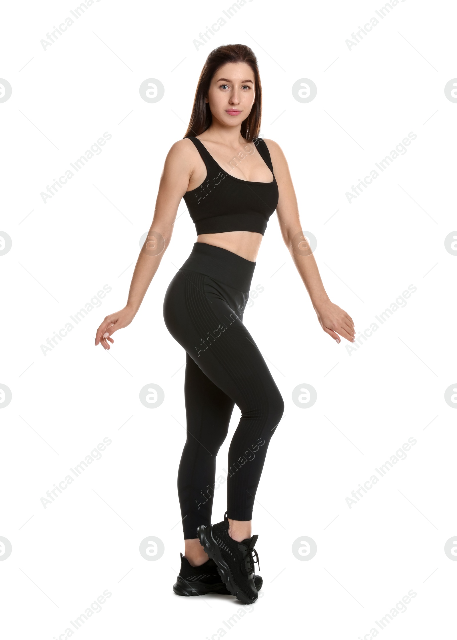 Photo of Portrait of woman in sportswear on white background