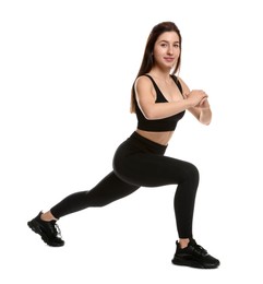 Photo of Woman in sportswear exercising on white background