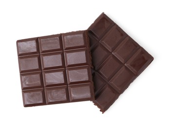 Photo of Pieces of delicious dark chocolate bar isolated on white, top view