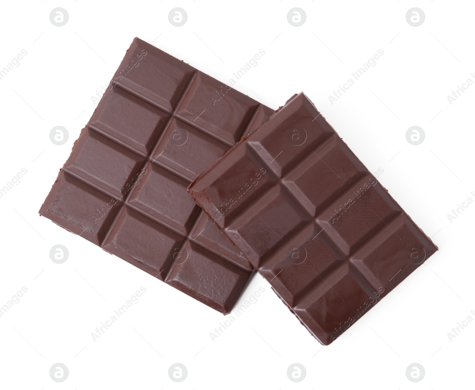 Photo of Pieces of delicious dark chocolate bar isolated on white, top view