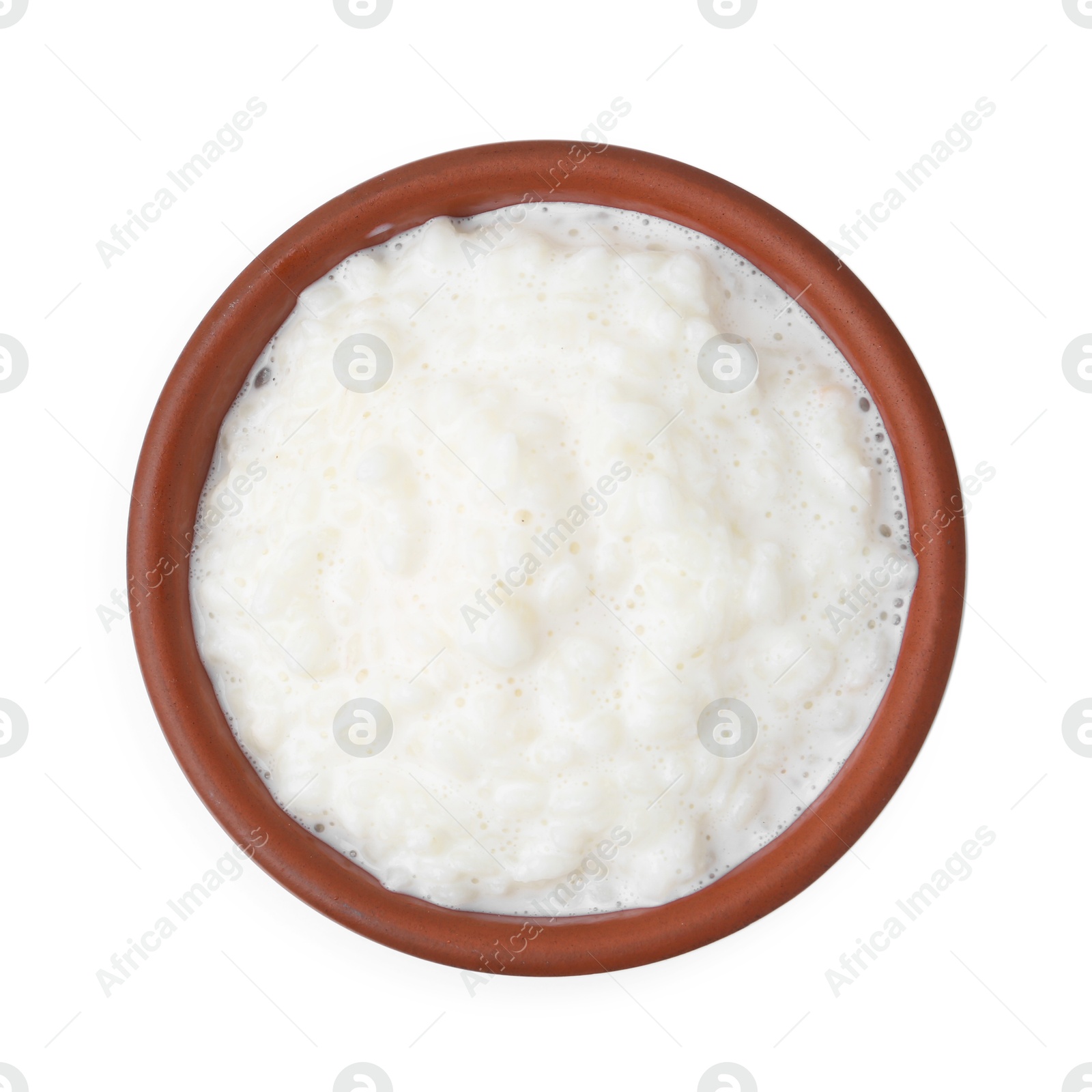 Photo of Delicious rice pudding in bowl isolated on white, top view