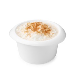 Photo of Delicious rice pudding with cinnamon isolated on white