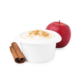 Photo of Delicious rice pudding with cinnamon and apple isolated on white