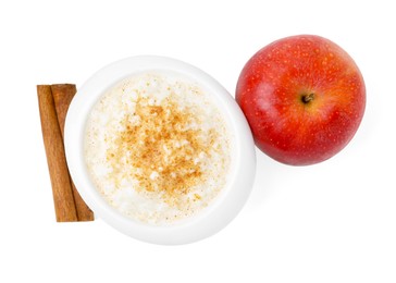 Photo of Delicious rice pudding with cinnamon and apple isolated on white, top view