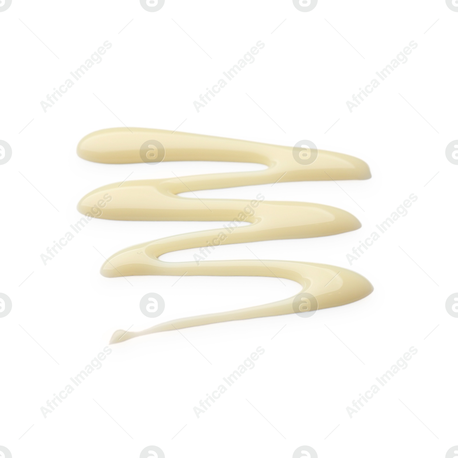 Photo of Spilled tasty condensed milk isolated on white