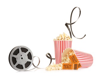 Photo of Tasty popcorn, film reel and movie tickets isolated on white