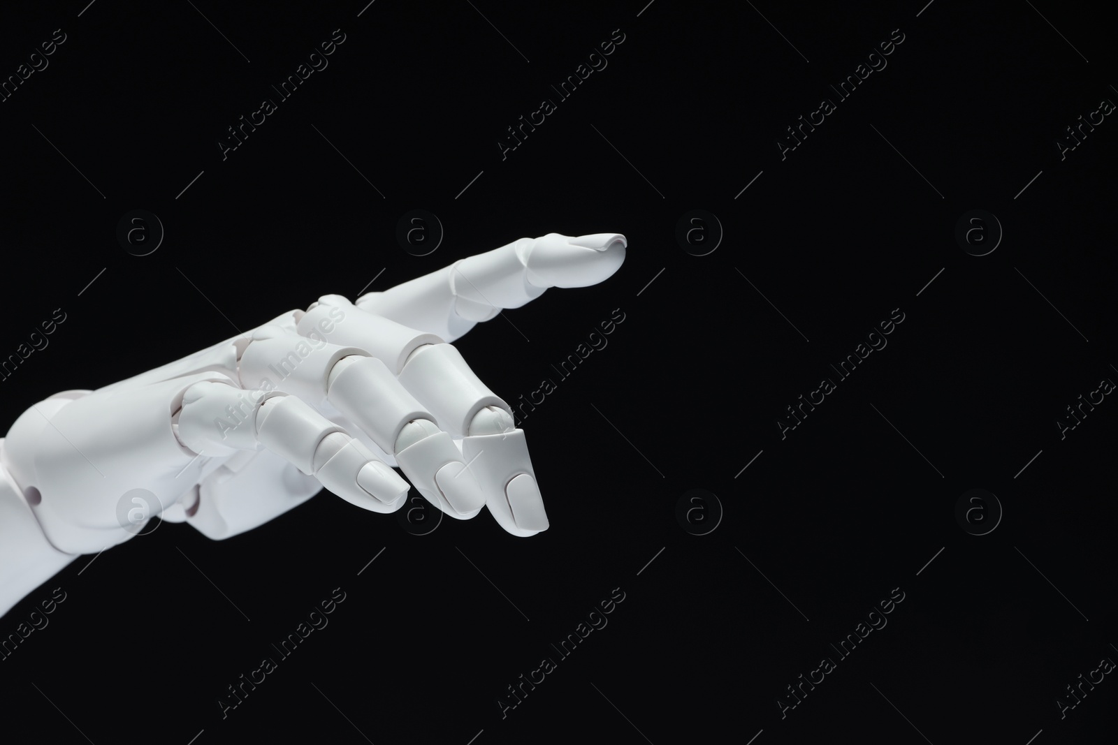 Photo of Artificial intelligence. Robot hand gesturing on black background, space for text