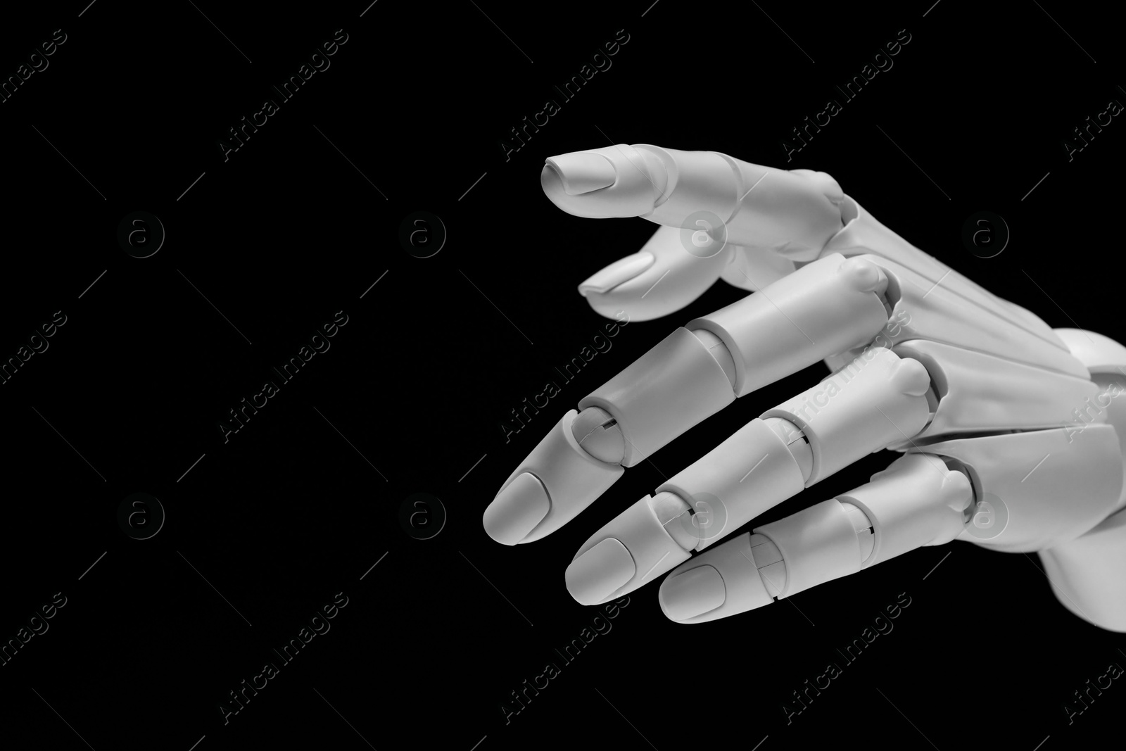 Photo of Artificial intelligence. Robot hand gesturing on black background, space for text