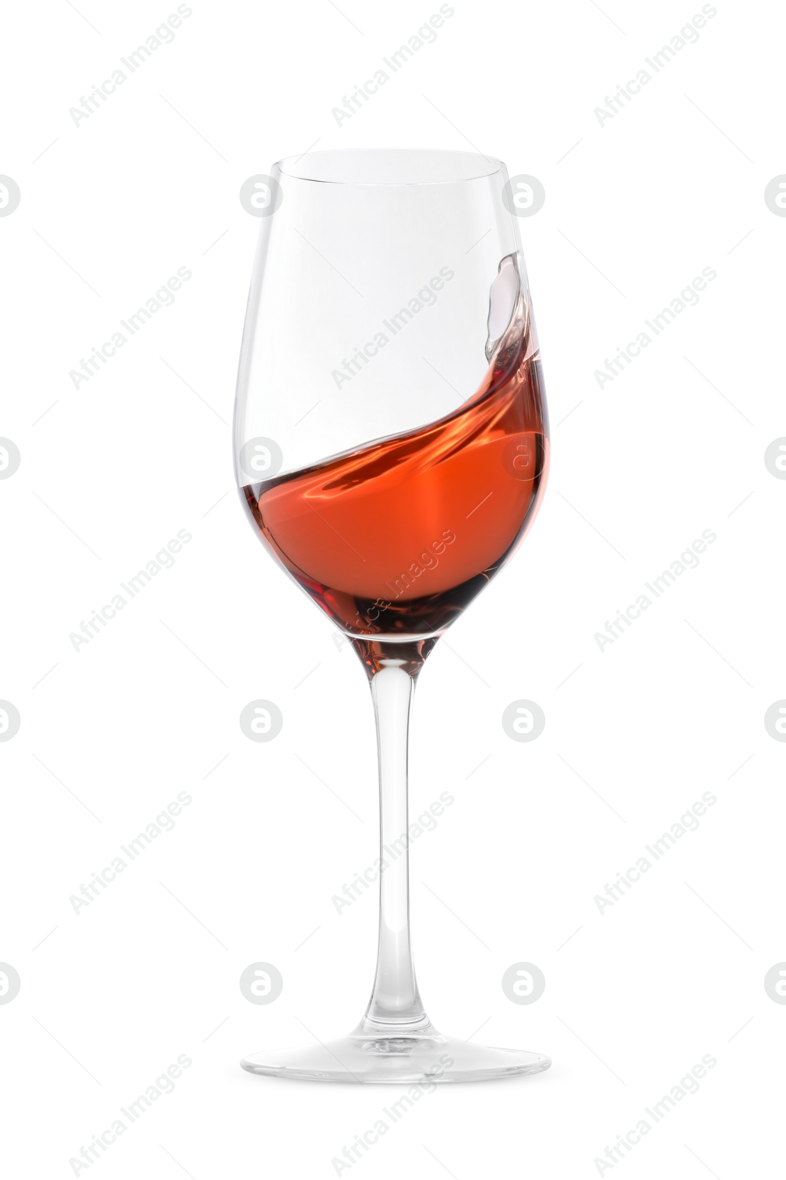 Photo of Rose wine splashing in glass on white background