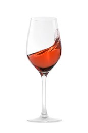 Photo of Rose wine splashing in glass on white background