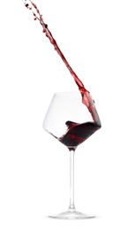 Photo of Red wine splashing in glass on white background