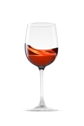 Photo of Rose wine splashing in glass on white background