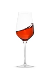 Photo of Rose wine splashing in glass on white background