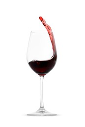 Photo of Red wine splashing in glass on white background