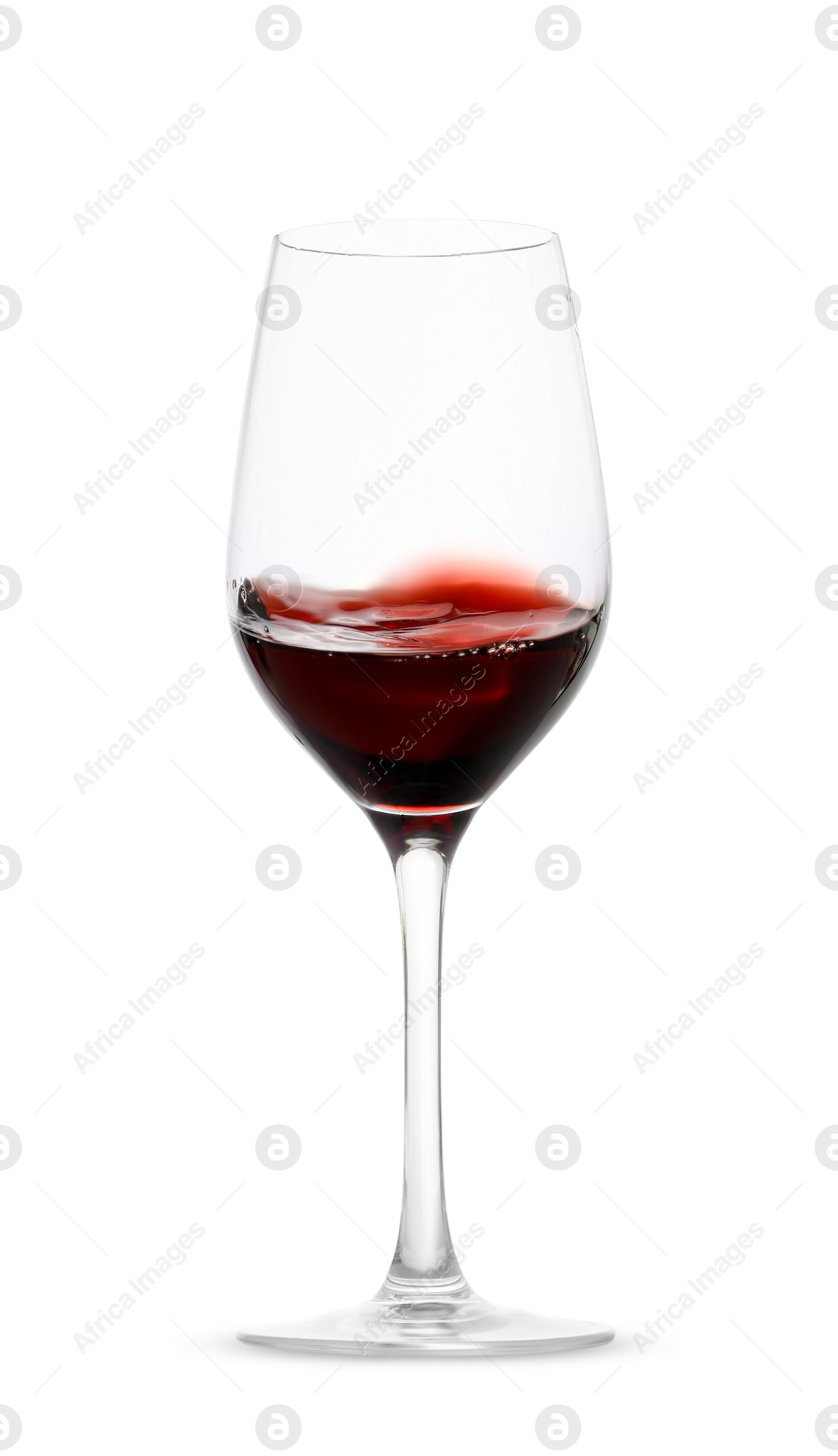 Photo of Red wine splashing in glass on white background