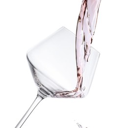 Photo of Pouring rose wine into glass isolated on white