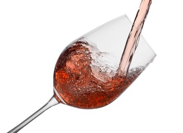 Photo of Pouring rose wine into glass isolated on white