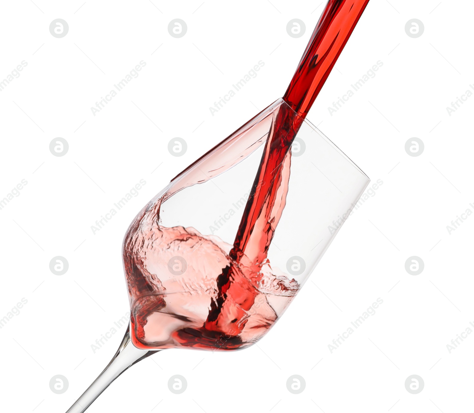 Photo of Pouring red wine into glass isolated on white