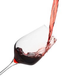 Photo of Pouring red wine into glass isolated on white