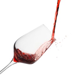 Photo of Pouring red wine into glass isolated on white