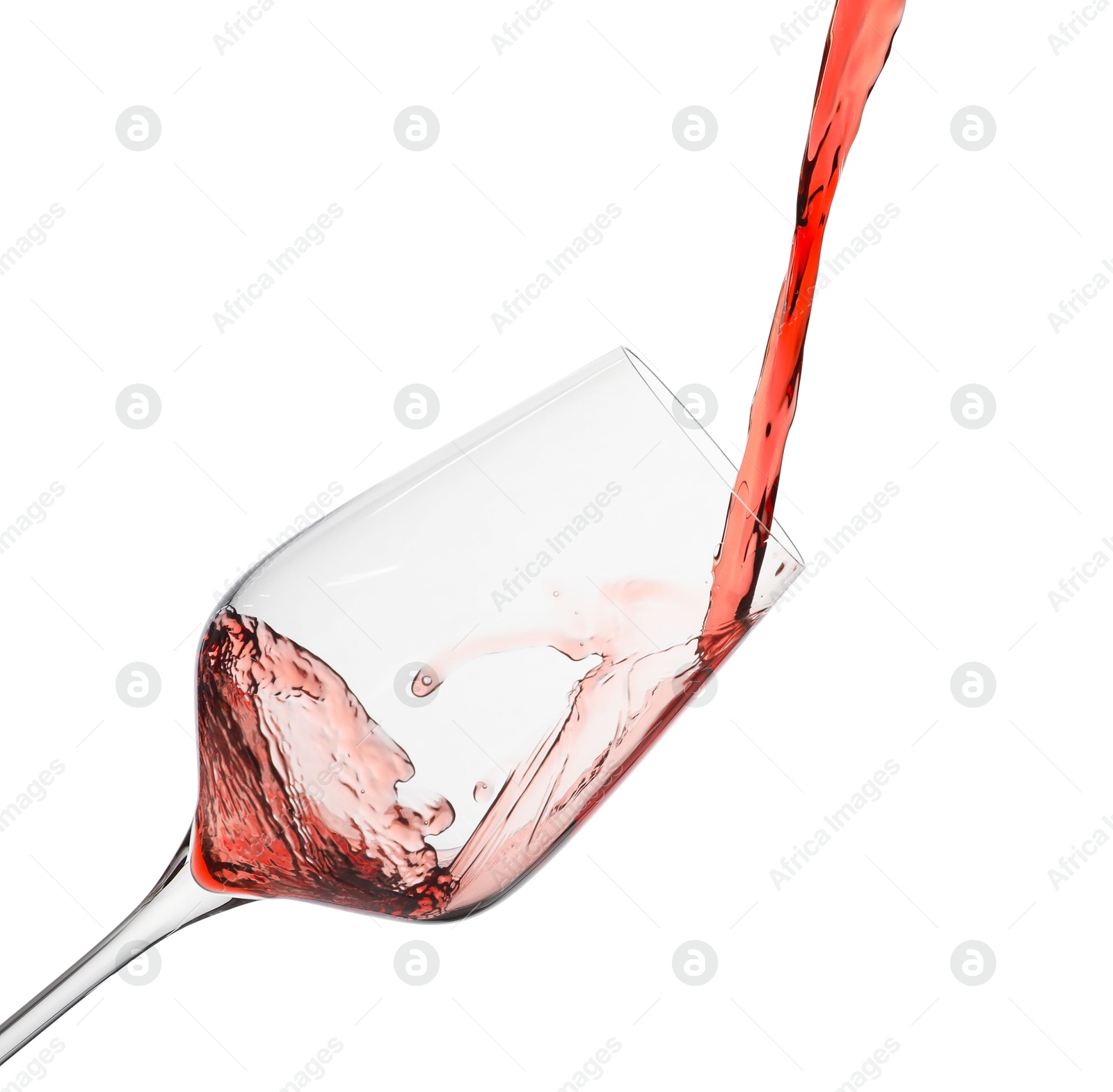 Photo of Pouring red wine into glass isolated on white