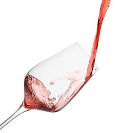 Photo of Pouring red wine into glass isolated on white