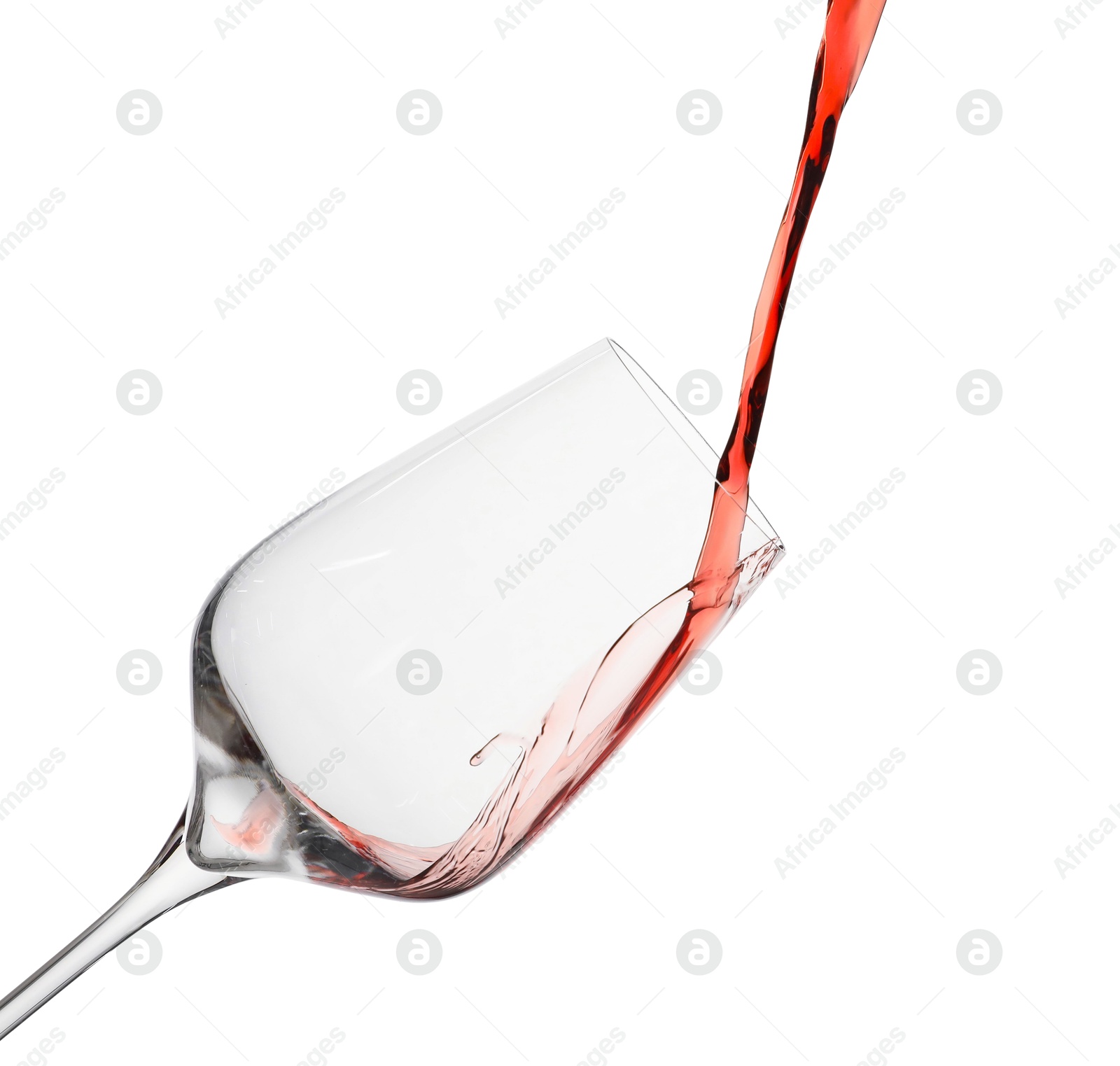 Photo of Pouring red wine into glass isolated on white