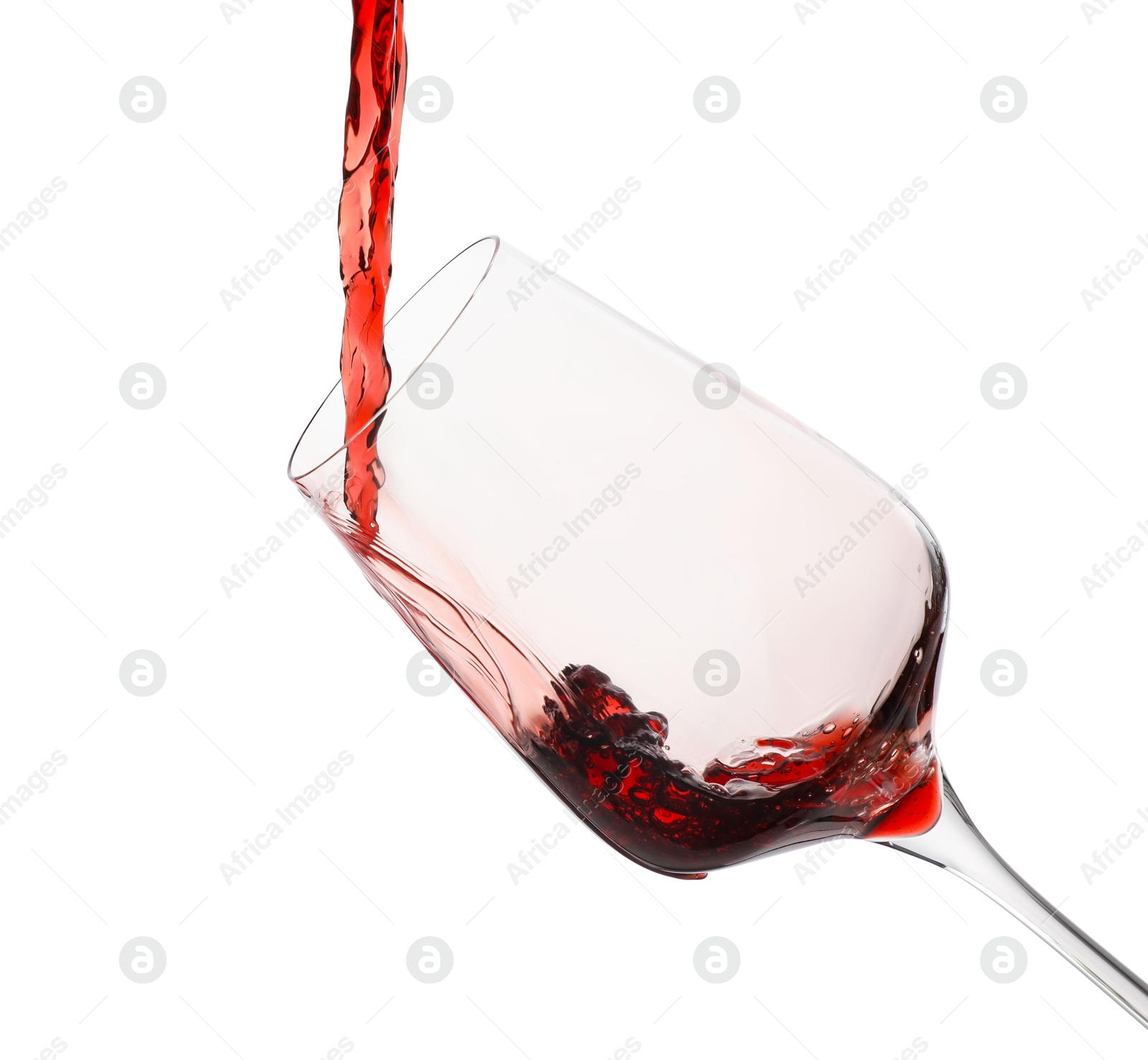 Photo of Pouring red wine into glass isolated on white