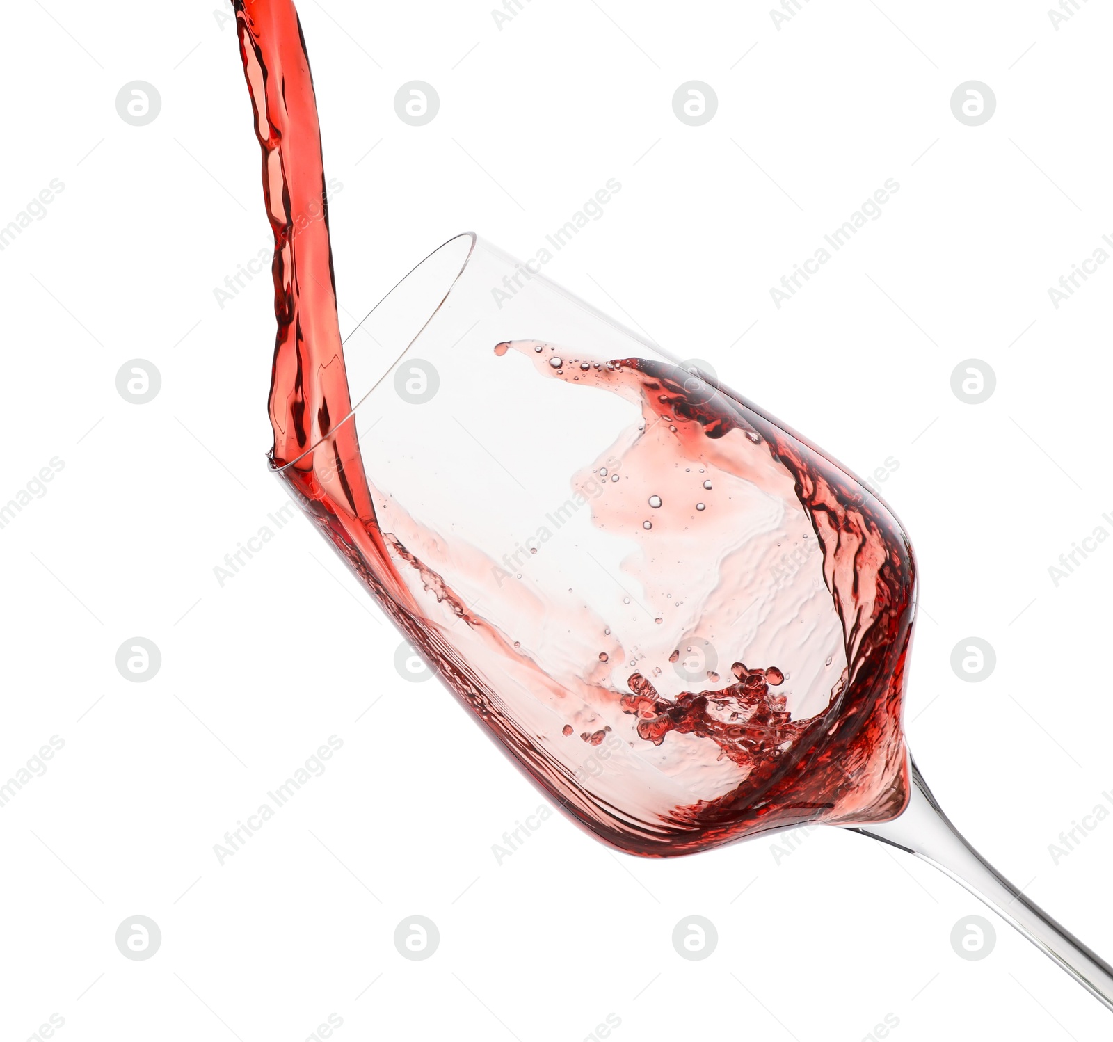 Photo of Pouring red wine into glass isolated on white