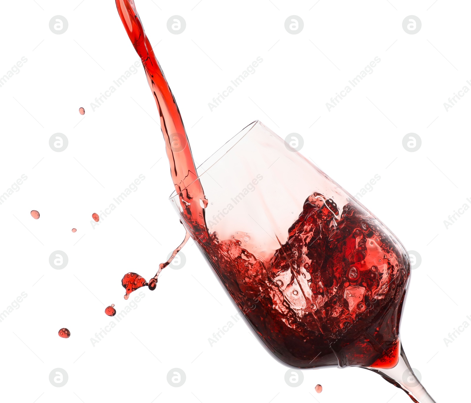 Photo of Pouring red wine into glass isolated on white