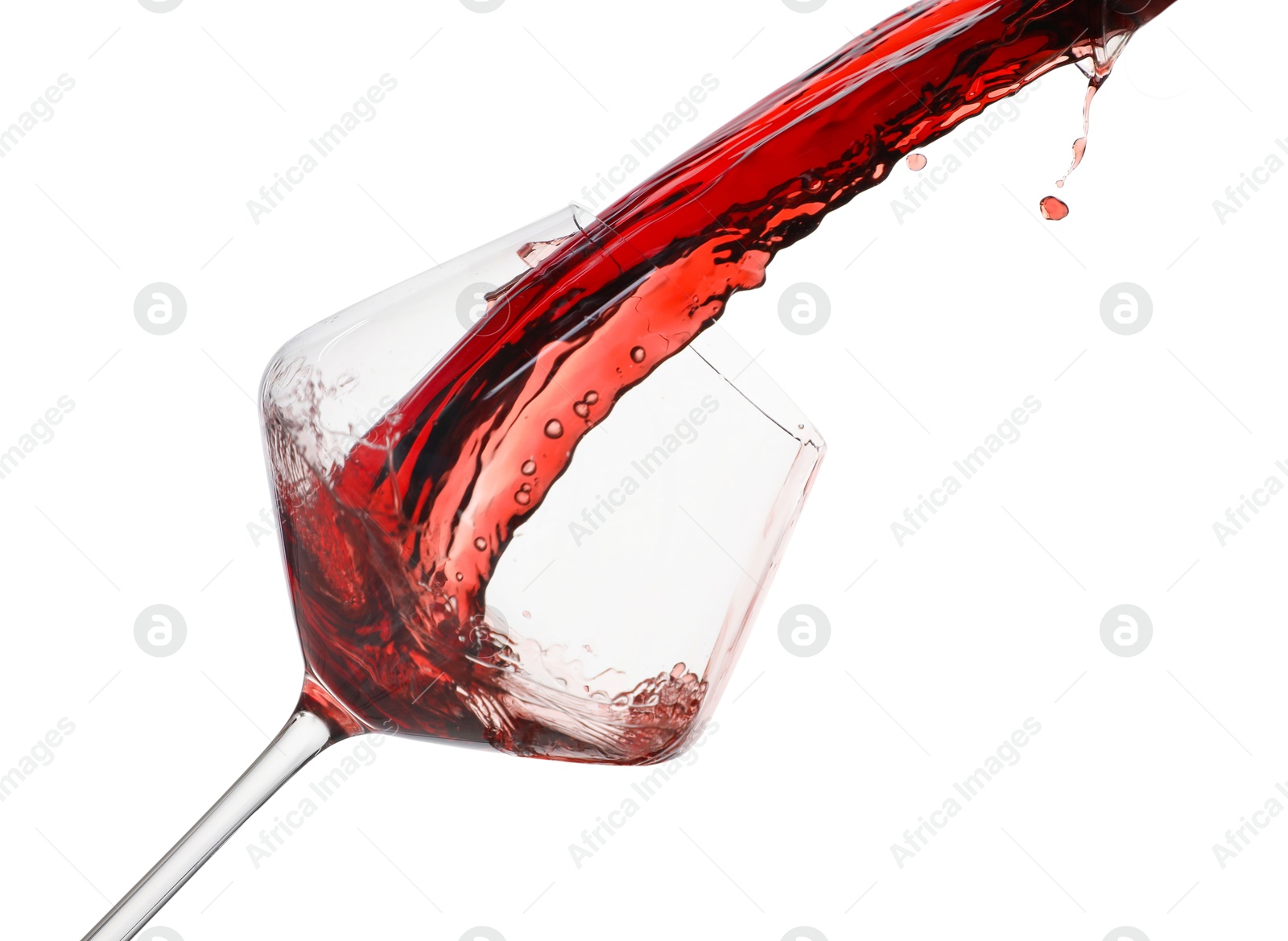 Photo of Pouring red wine into glass isolated on white