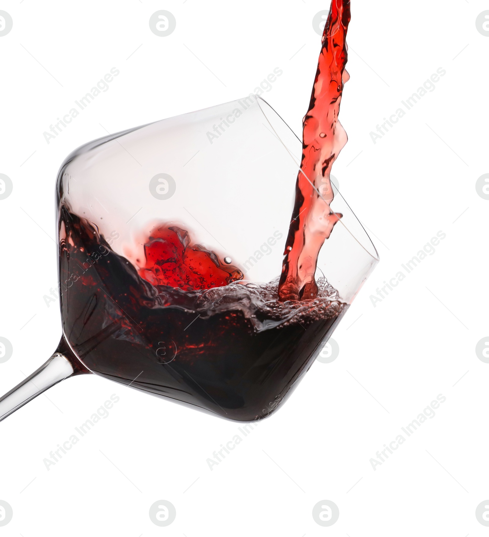 Photo of Pouring red wine into glass isolated on white