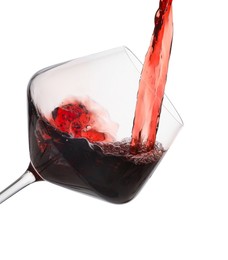 Photo of Pouring red wine into glass isolated on white