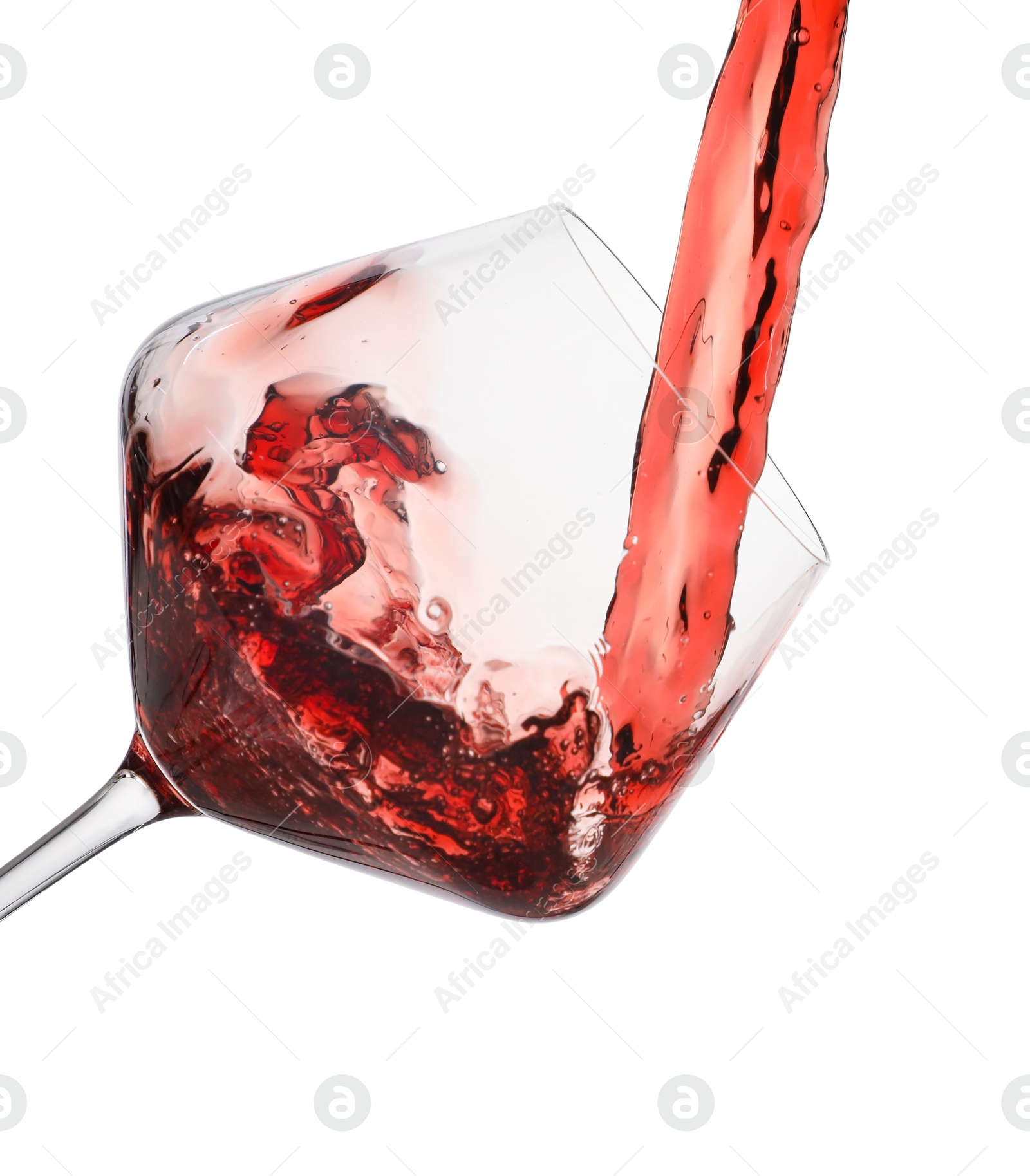 Photo of Pouring red wine into glass isolated on white