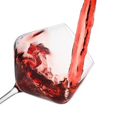 Photo of Pouring red wine into glass isolated on white