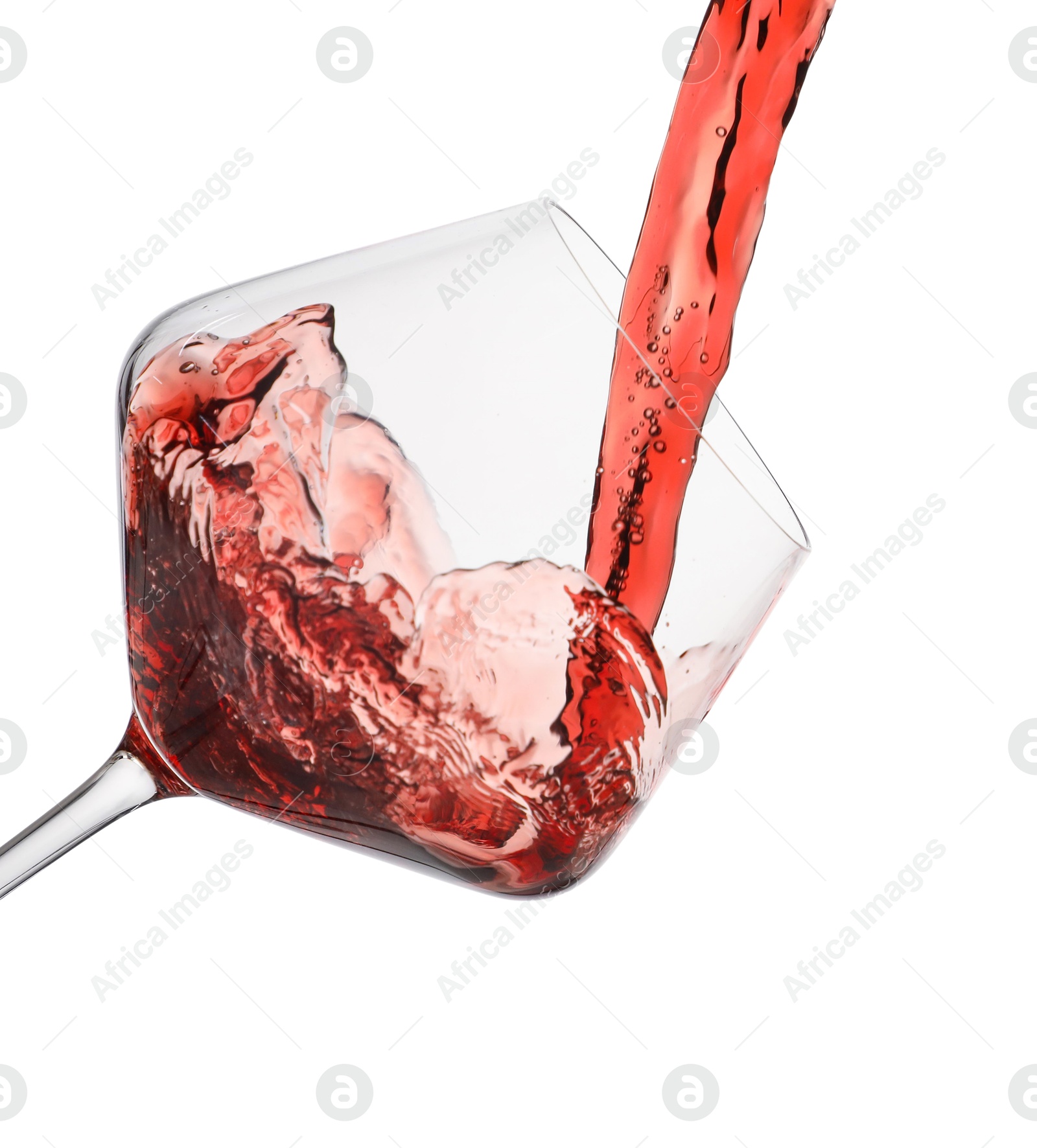 Photo of Pouring red wine into glass isolated on white