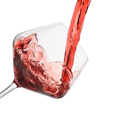 Photo of Pouring red wine into glass isolated on white