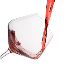 Photo of Pouring red wine into glass isolated on white