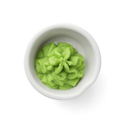 Photo of Hot wasabi paste in bowl isolated on white, top view