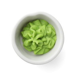 Photo of Hot wasabi paste in bowl isolated on white, top view