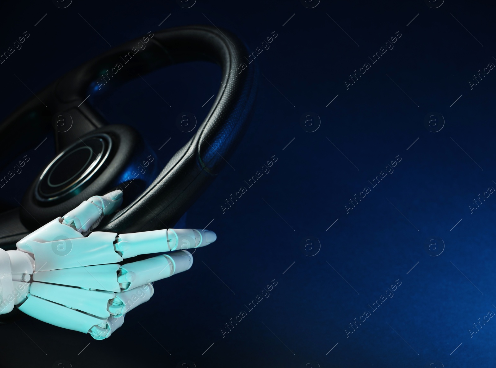 Photo of Artificial intelligence. Robot hand with steering wheel on dark blue background, closeup. Space for text