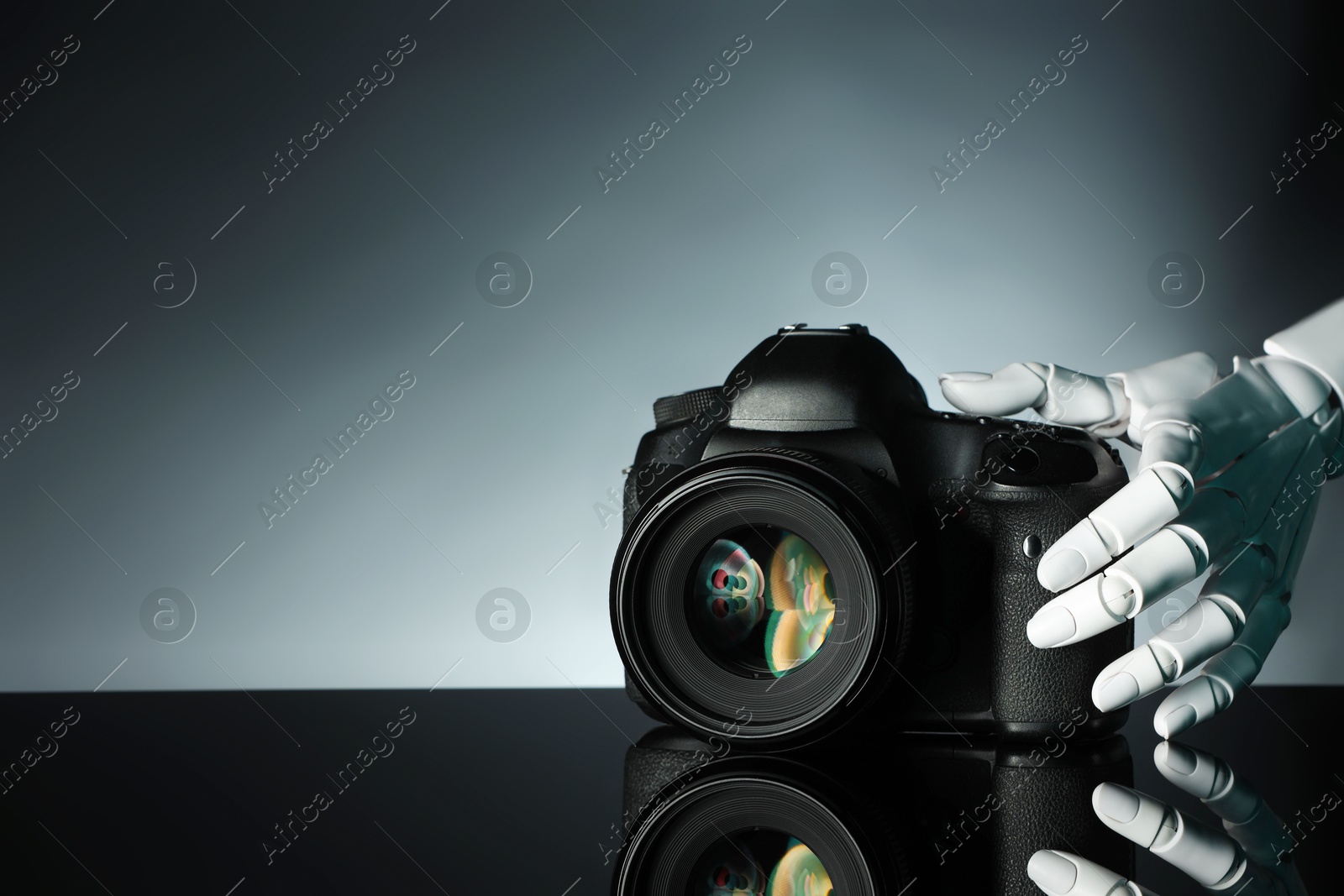 Photo of Artificial intelligence. Robot hand with photo camera against grey background, closeup. Space for text