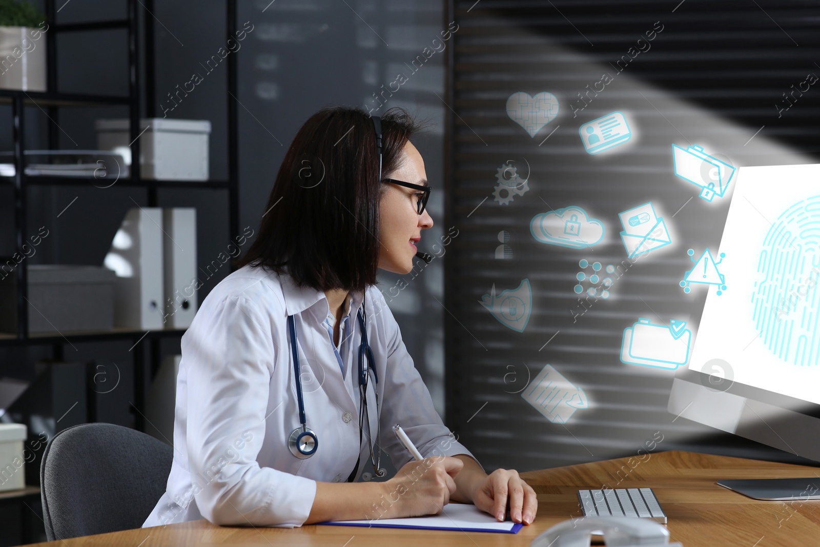 Image of Medical privacy and confidentiality. Doctor working at table in office. Different icons coming out of computer screen