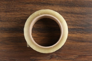 One adhesive tape on wooden table, top view