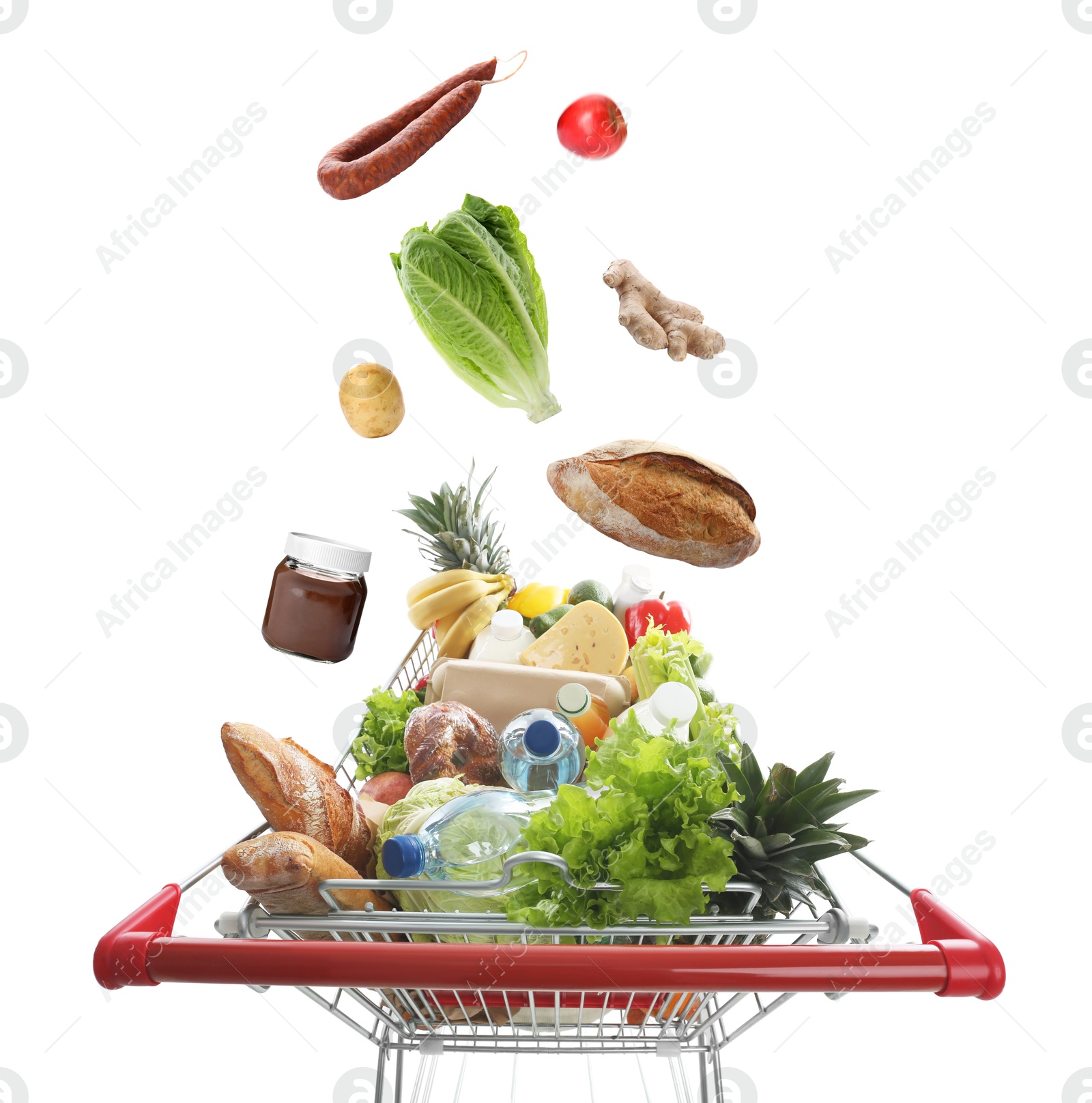 Image of Groceries falling into shopping cart on white background