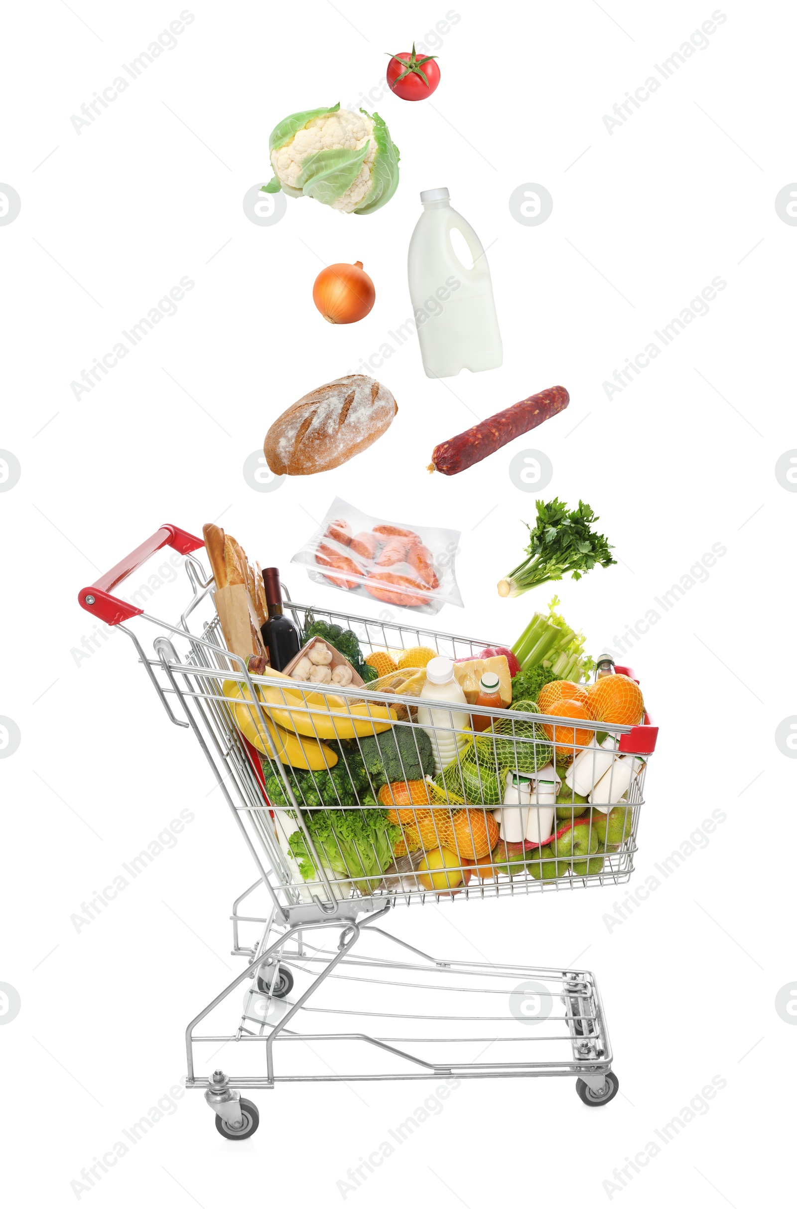 Image of Groceries falling into shopping cart on white background