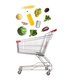 Image of Groceries falling into shopping cart on white background