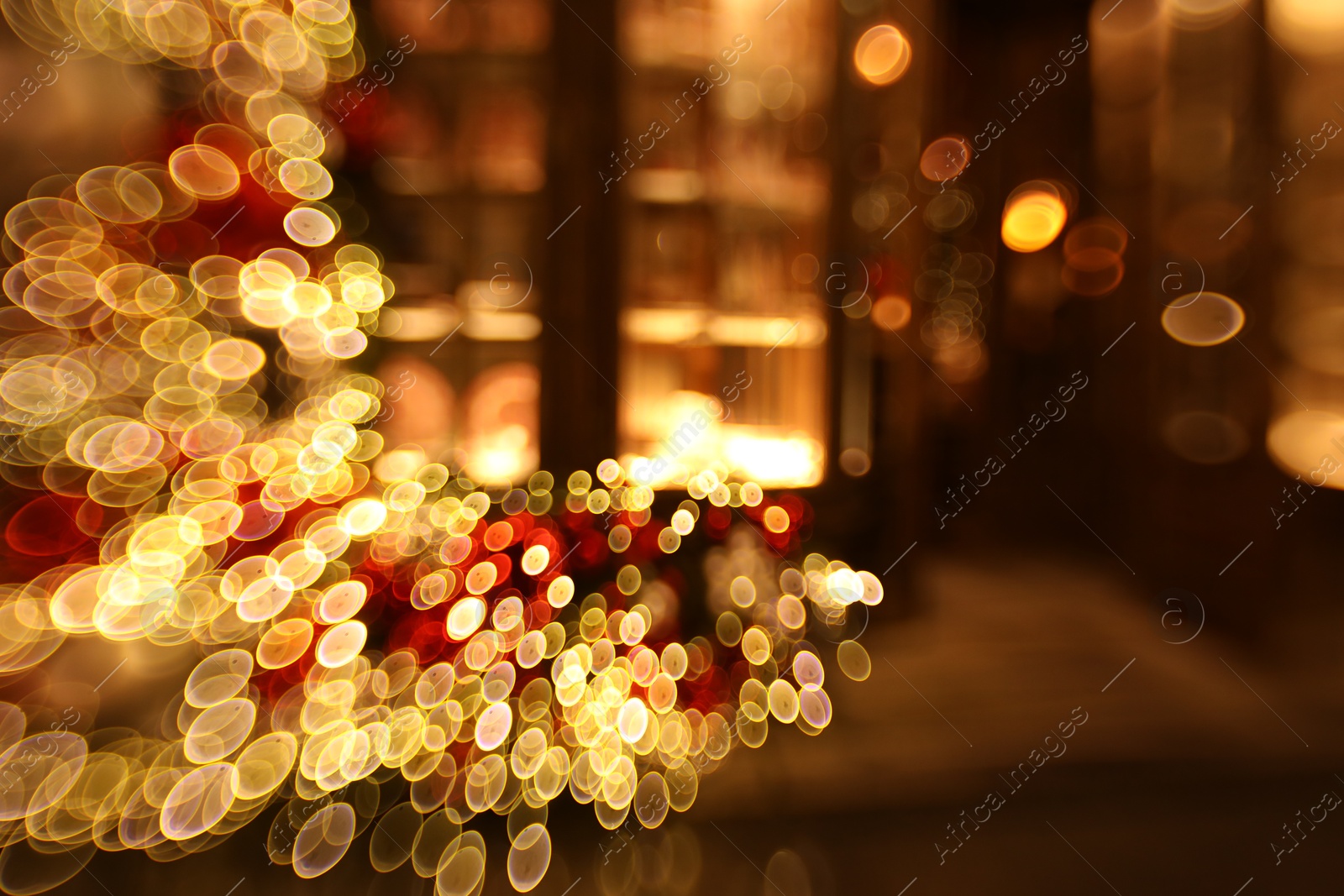 Photo of Blurred view of city street with lights, bokeh effect