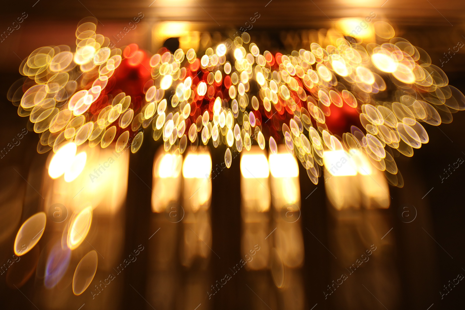 Photo of Blurred view of city street with lights, bokeh effect